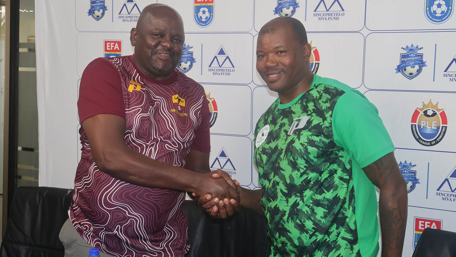 Buffaloes Coach Dominic Kunene (L) and Nsingizini gaffer Mandla Qhogi shake hands after yesterday’s pre-match briefings at Sigwaca House. 